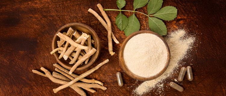 Blog of How Much Ashwagandha for Stress, Sleep, Energy Support, and Wellness which have image A collection of ashwagandha roots, powder, leaves, and capsules displayed on a rustic wooden surface.