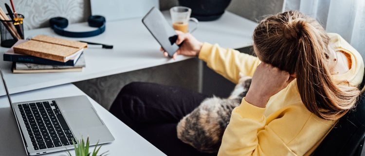 Blog of Popcorn Brain Explained: What It Is, Why It Happens, and How to Increase Attention Span which have image woman on her phone at work
